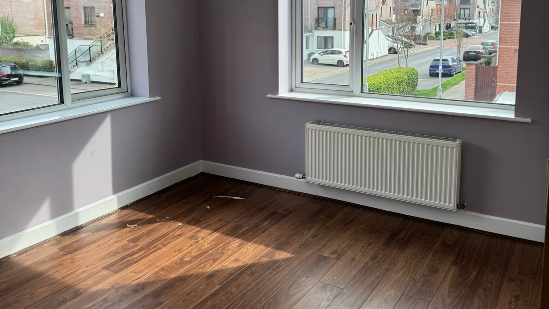 Freshly painted lilac bedroom with walnut floor in a Dublin home